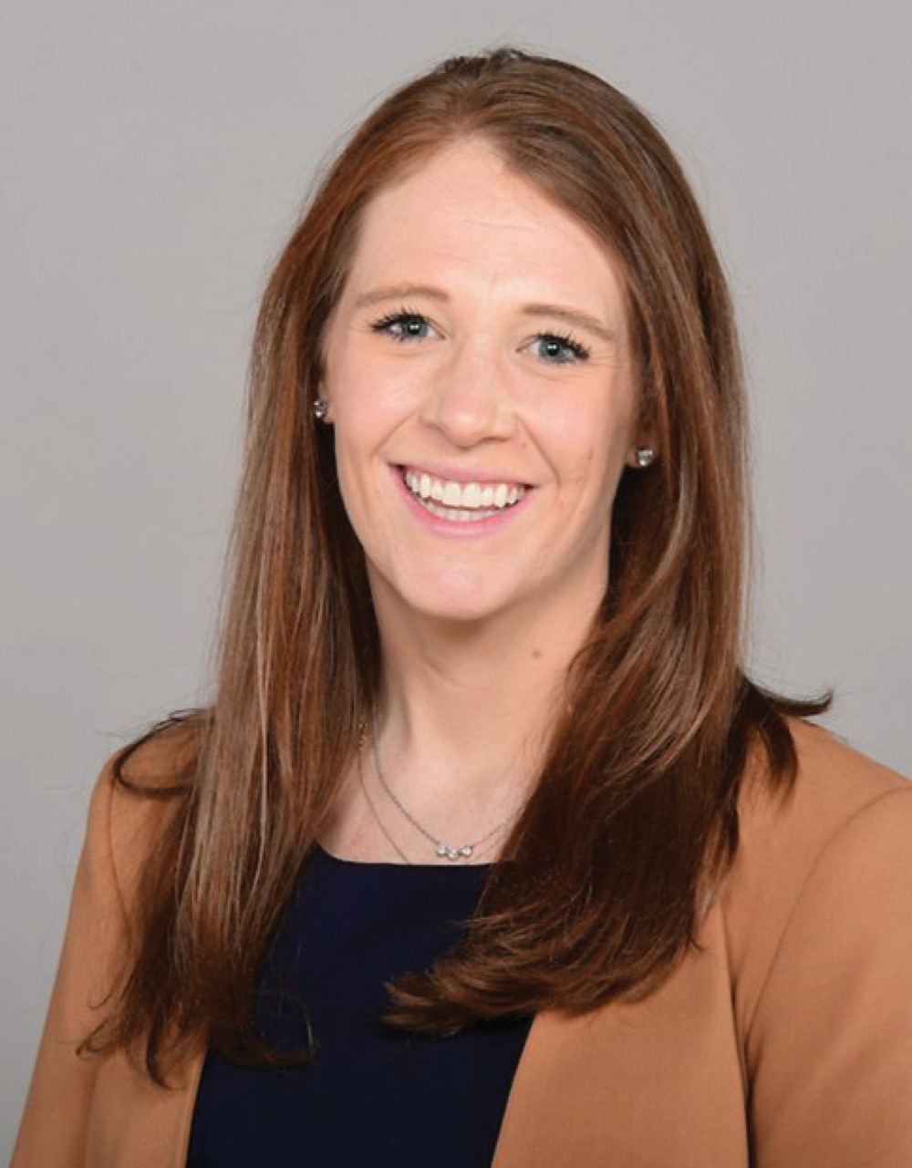 Headshot photograph of Sara Denney smiling